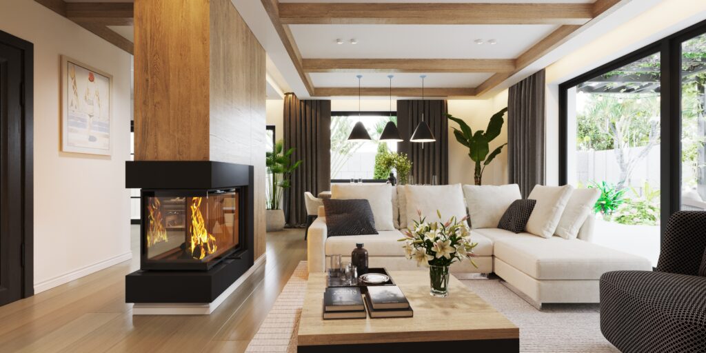 WIUMI projektowanie wnętrz Wrocław przedstawia na foto piękny salon z kominkiem, wielką kanapą oraz dużymi oknami i jadalnią w tle oraz pięknymi zasłonami.